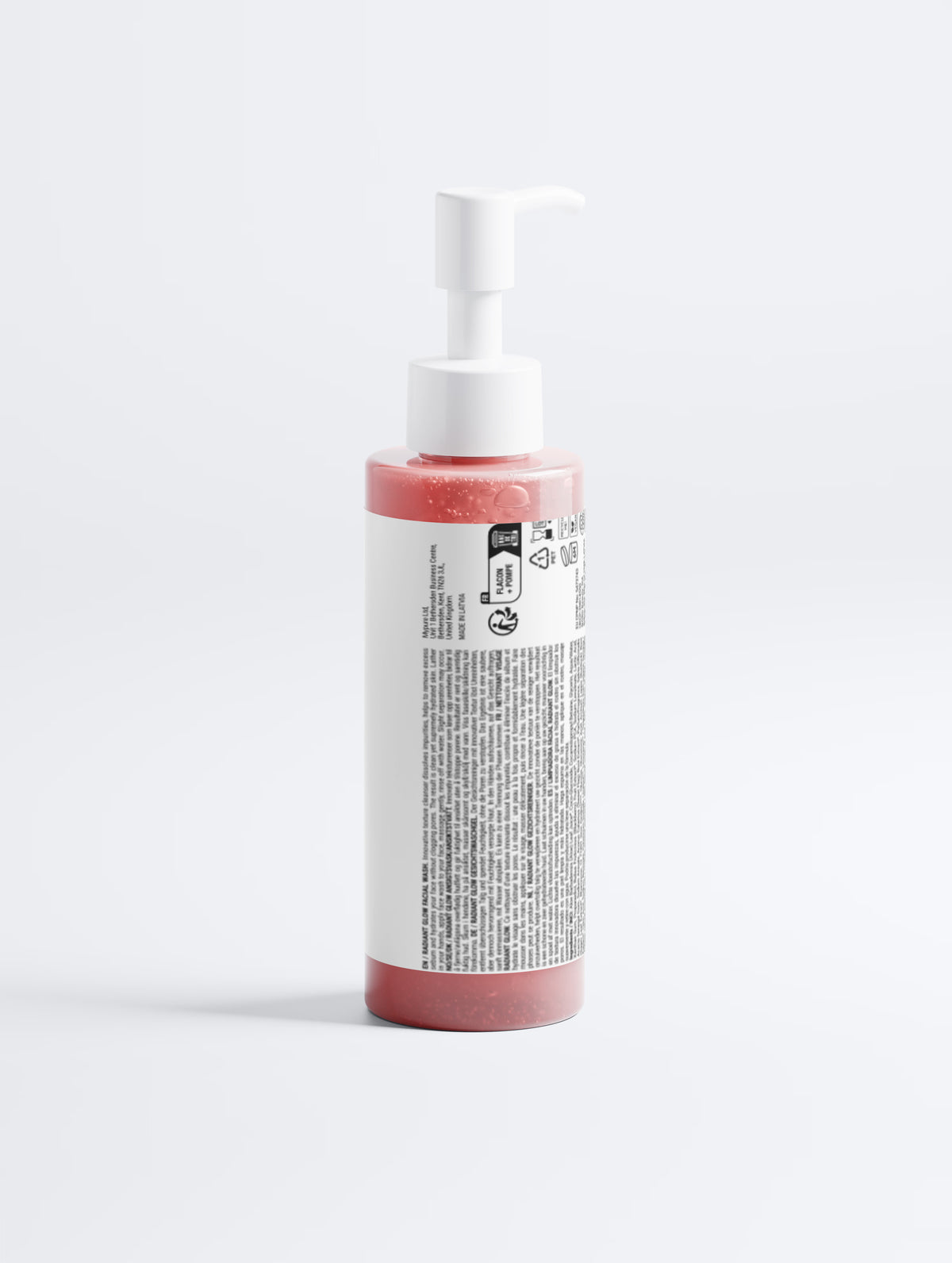 Bottle with pink liquid and white label on a light gray background